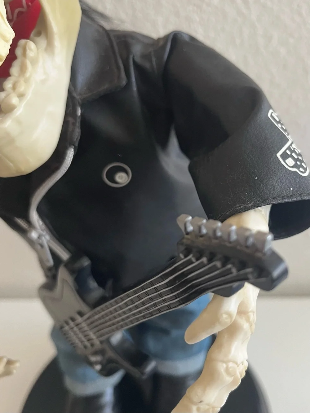 Skeleton Guitarist Décor with Red Bandana and Black Jacket